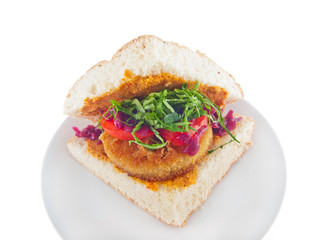 vegan bread with breaded spiced tofu, mashed eggplant and carrot spread and vegetables