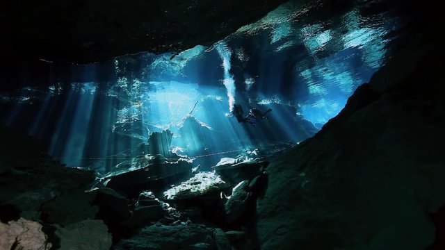 Underwater stalactites and stalagmites in landscape Mexican Sacred Mayan Cenote. Deep underground clean and clear fresh lake in cave. Unique shooting Wonders of Yucatan Peninsula nature in Dos Ojos.
