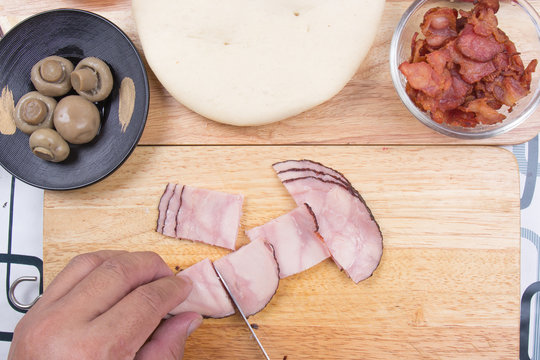 Chef slicing Ham