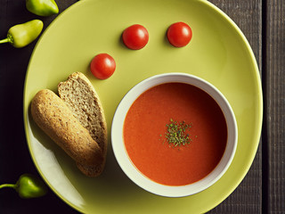 Homemade tomato soup with tomatoes, herbs and spices. Comfort food. Close up.
