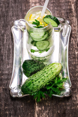 Fresh cold cucumber drink on wooden table