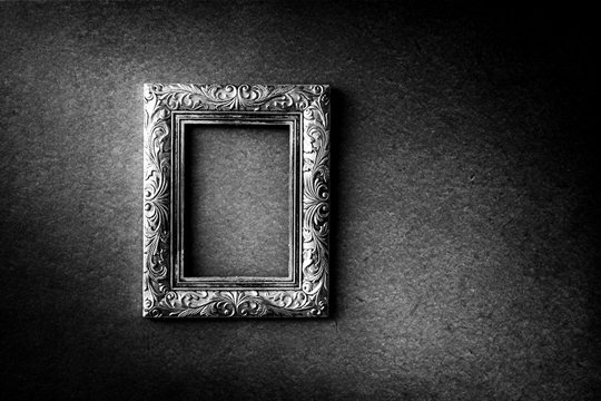 Silver vintage photo frame over grunge background, black and white, Still life style