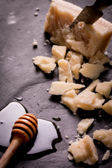 Composition of cheese, berries, bottles and glasses of wine on a wooden table