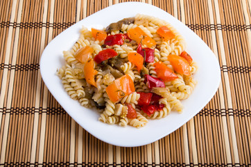 Italian pasta fusilli wooden background