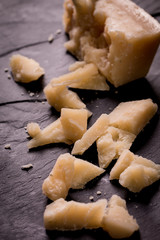 Composition of cheese, berries, bottles and glasses of wine on a wooden table