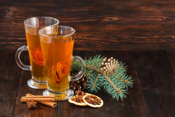 Compote of dried fruits with ingridients on dark rustic wooden background