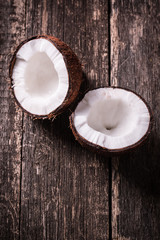 Fototapeta na wymiar Coconut on wooden table.Vintage filter. Organic healthy food concept.Beauty and SPA concept.