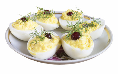 Stuffed egg with cranberry and green dill