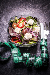 Diet concept, salad ingredients on black background . healthy food