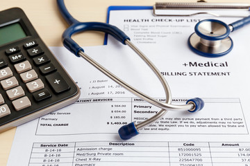 Medical cost concept with calculator and stethoscope - Powered by Adobe