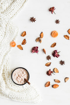 Autumn. Hot chocolate, knitted blanket, dried flowers and leaves. Flat lay, top view