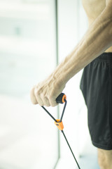 Man exercising nude torso