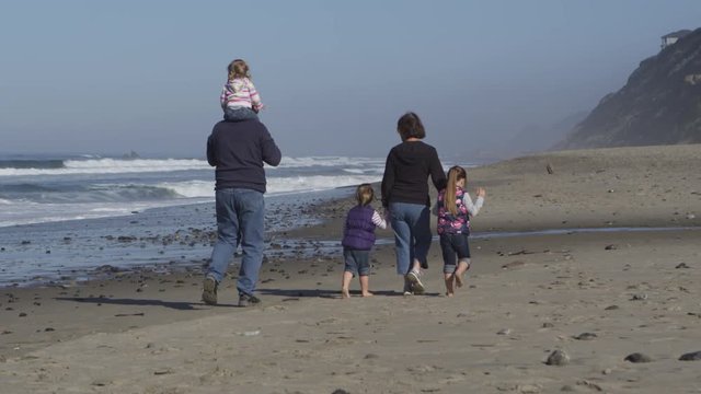 Family on the beach - 4K