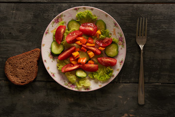 Vegetable salad and bread on the table