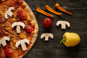 pizza and vegetables on the table