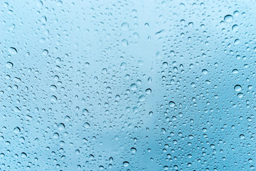 Rain dew drop on dirty glass with dirt dust and scratches, selective focus with vintage color tone effect,Water Abstract background.