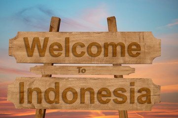 Welcome to Indonesia sing on wood background