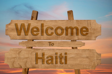 Welcome to Haiti sing on wood background