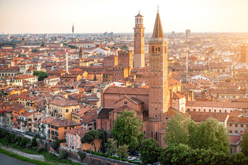 Fototapeta na wymiar Aerial view on Verona old town with Lamberty and church towers on the sunset