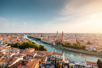 Panoramic aerial view on Verona old town from the castle hill on the sunset - obrazy, fototapety, plakaty