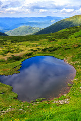 Naklejka na ściany i meble Carpathian mountains landscape, view from the height, Nesamovyte lake under hill.