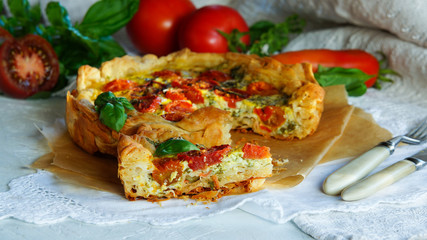Snack tart from homemade filo dough with mozzarella, basil, tomatoes and garlic