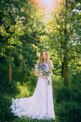 Fototapeta premium stylish boho bride holding rustic bouquet of amazing flowers