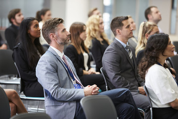 Audience Listening To  Speaker At Conference Presentation