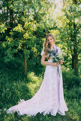 Fototapeta premium stylish boho bride holding rustic bouquet of amazing flowers