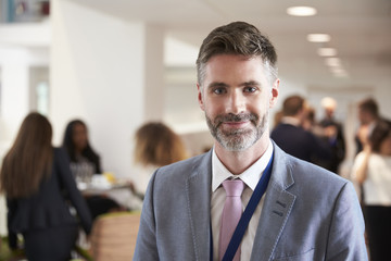 Portrait Of Male Delegate During Break At Conference