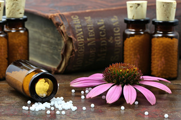 Fototapeta homeopathic echinacea pills on wooden background obraz