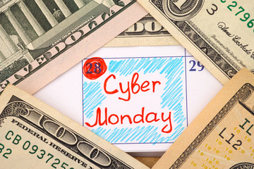 Reminder Cyber Monday in calendar with dollar banknotes