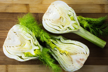 Fresh fennel on wooden cutting boarg, kitchen. © ftania