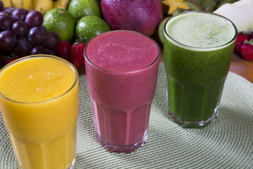 Glasses of juice with fresh fruits for summer
