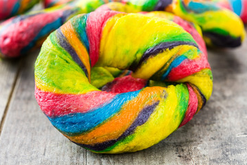 Colorful bagels on a wooden table


