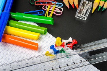 Colourful School Supplies on a Blackboard. Back to School.