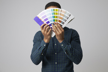 Studio Portrait Of Graphic Designer With Color Swatches