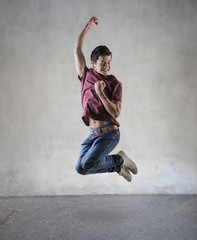 Fototapeta na wymiar Jubilant guy jumping