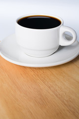 White Cup of Coffee on Wooden