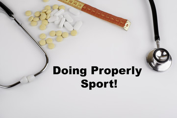 Doing properly sport. White background with pills, stethoscope a