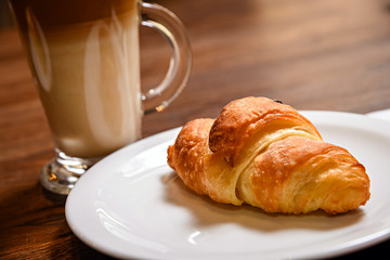 up of coffee and croissant
