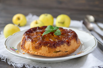 Homemade apple pie with caramel and fresh apples, rustic style, selective focus
