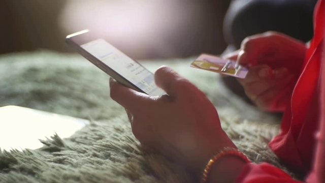 Woman pays a purchase with a credit card