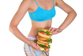 Beautiful female hands hold three burger. Closeup.
