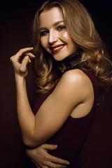 Fototapeta premium Girl smiling on a red background