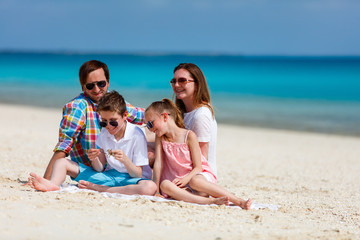 Fototapeta na wymiar Family on a tropical beach vacation