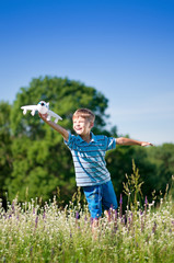 Boy with toy airplane