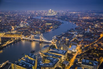 Zelfklevend Fotobehang London, England - Aerial Skyline view of London with the iconic Tower Bridge, Tower of London and skyscrapers of Canary Wharf at dusk © zgphotography