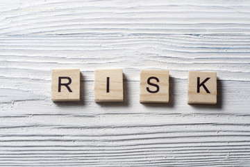 Wooden Blocks with the text Risk