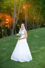 Fototapeta premium Bride with a wreath on his head, outside the city